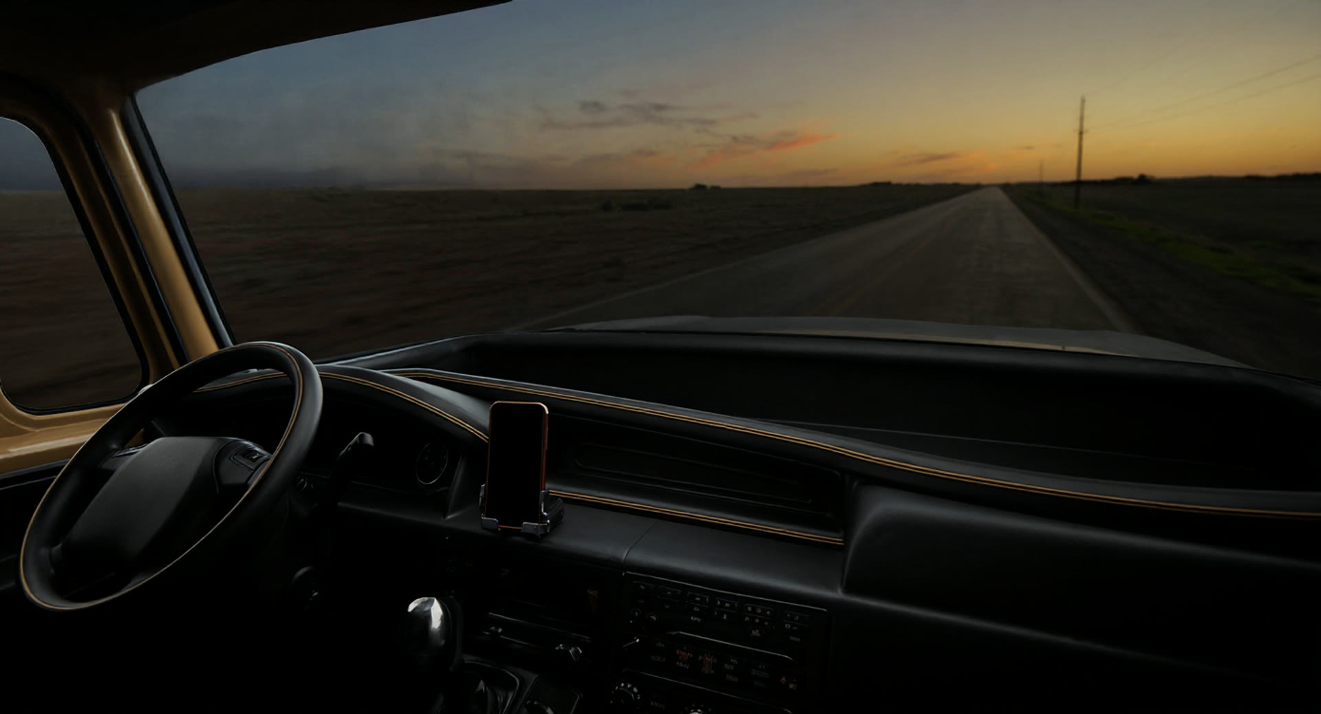Cinematic view inside a black and gold truck cabin